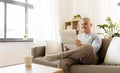 Happy man reading newspaper at home Royalty Free Stock Photo