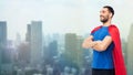 Happy man in red superhero cape over city Royalty Free Stock Photo