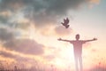 Happy man rise hand Worship God in morning view. Christian spirit prayer praise on good friday background. Male self confidence Royalty Free Stock Photo