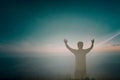 Happy man rise hand Worship God in morning view. Christian spirit prayer praise on good friday background. Male self confidence Royalty Free Stock Photo