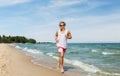 Happy man running along summer beach Royalty Free Stock Photo