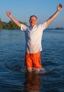 Happy man running in water Royalty Free Stock Photo