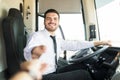 Happy Man Selling Tickets In Bus