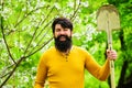 Happy man with shovel preparing to planting. Gardener work. Spring farming. Farmer with garden spade.