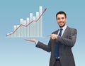 Happy man showing growth chart on palm of his hand Royalty Free Stock Photo