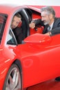 happy man showing key new red sports car Royalty Free Stock Photo