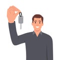 Happy man showing off car keys after getting loan or leasing to buy new car. Guy selling automobile dealership with smile