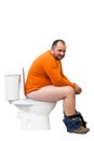 Happy man sitting on toilet