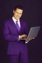 Happy man smiling with laptop or computer Royalty Free Stock Photo