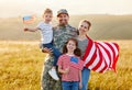 Happy man soldier reunited with his patriotic american family Royalty Free Stock Photo