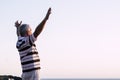 Happy of man standing alone with arms raised up during beautiful sunrise at the sunset. Enjoying with nature - retired man feels Royalty Free Stock Photo