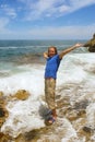 Happy man stands in foamy wave Royalty Free Stock Photo