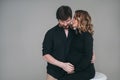 A happy man stands next to his pregnant girlfriend. loving parents are waiting for the birth of a baby. Husband hugs his Royalty Free Stock Photo