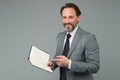 Happy man in suit with book. accountant maintains accounting records. making notes in notebook. View the to-do list in Royalty Free Stock Photo