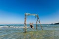 Happy man on swing in Sao beach Royalty Free Stock Photo