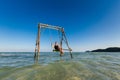 Happy man on swing in Sao beach Royalty Free Stock Photo