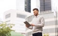 Happy man with tablet pc computer in city Royalty Free Stock Photo