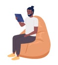 Happy man with tablet sitting on beanbag chair semi flat color vector character