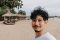 Happy man take selfie with palm tree on the beach. Summer travel concept. Royalty Free Stock Photo