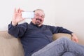 Happy man taking a selfie for his friends Royalty Free Stock Photo