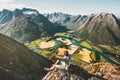 Happy Man traveler alone relaxing on cliff success raised hands Royalty Free Stock Photo