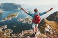 Happy Man traveler raised hands on mountain top Royalty Free Stock Photo