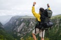 Young man traveling with backpack hiking in mountains Royalty Free Stock Photo