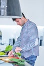 Happy man using digital tablet in kitchen at home Royalty Free Stock Photo