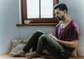 Happy man using mobile phone at home Royalty Free Stock Photo