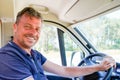 Happy man van driver behind steering wheel of car driving concept Royalty Free Stock Photo