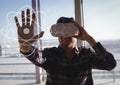 Happy man in VR headset touching interfaces Royalty Free Stock Photo