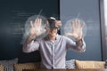 Happy man in VR headset touching interfaces with flares Royalty Free Stock Photo