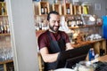 Happy man or waiter at bar cashbox Royalty Free Stock Photo