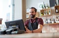 Happy man or waiter at bar cashbox Royalty Free Stock Photo