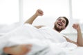 Happy man waking up in the morning Royalty Free Stock Photo