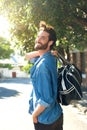 Happy man walking away with travel bag Royalty Free Stock Photo