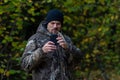 Happy man walking in the woods with a bent mouth