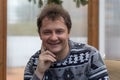 Happy man wearing sweater portrait indoor