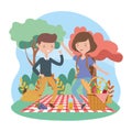 Happy man and woman food picnic blanket nature landscape