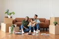 Happy man, woman and girl looking up at home Royalty Free Stock Photo