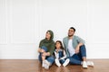 Happy man, woman and girl looking up at home Royalty Free Stock Photo