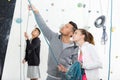 happy man and woman pointing at indoor climbing gym wall Royalty Free Stock Photo