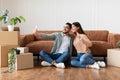 Happy man and woman taking selfie in their new apartment Royalty Free Stock Photo