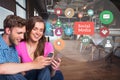 Happy man and woman using mobile phone by social media graphics Royalty Free Stock Photo