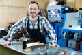 Happy man worker displaying his workplace Royalty Free Stock Photo