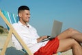 Happy man working with laptop. Business trip Royalty Free Stock Photo