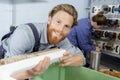 happy man working in wood workshop Royalty Free Stock Photo