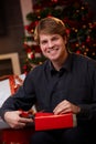 Happy man wrapping christmas presents Royalty Free Stock Photo