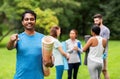 Happy man with yoga mat pointing finger to camera Royalty Free Stock Photo