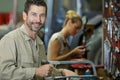 happy manual worker cutting metal in industry Royalty Free Stock Photo